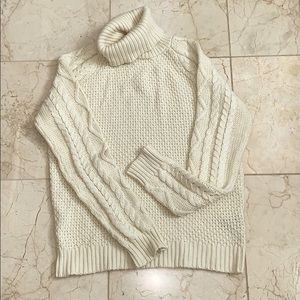 Cream turtle neck sweater.